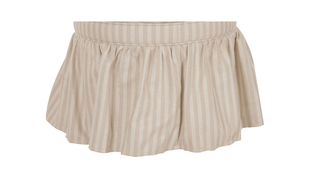 Ottoman de rangement HEIDI rayures beige, détail de la jupe froncée