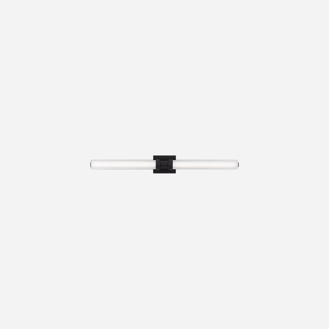 Applique murale Maison Olive Kiel au design minimaliste avec diffuseur cylindrique en verre givré et support noir