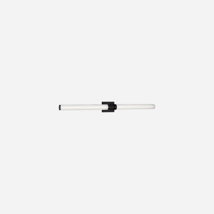 Applique murale Maison Olive Kiel au design minimaliste avec diffuseur cylindrique en verre givré et support noir