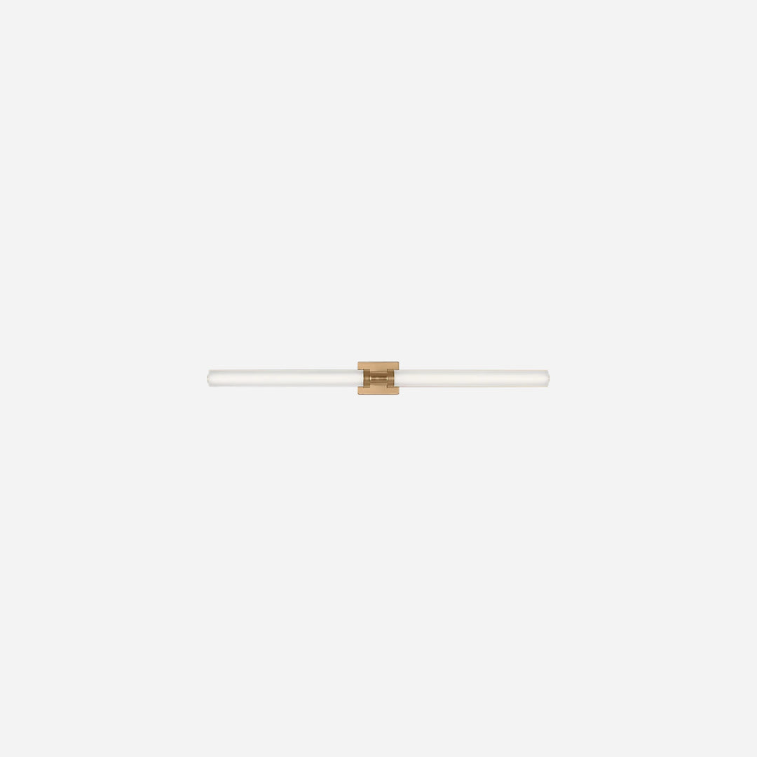 Applique murale Maison Olive Kiel au design minimaliste avec diffuseur cylindrique en verre givré et finition dorée