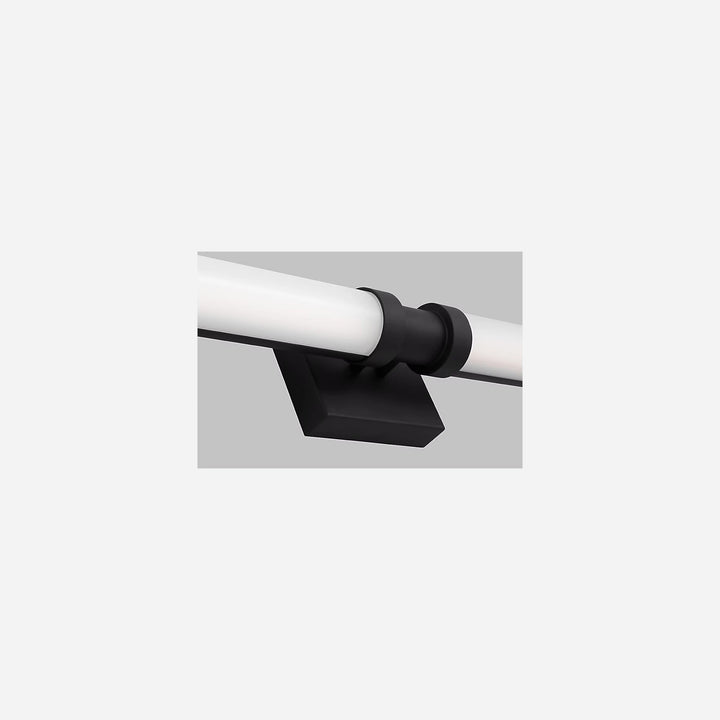 Applique murale Maison Olive Kiel avec diffuseur cylindrique en verre givré et support noir minimaliste
