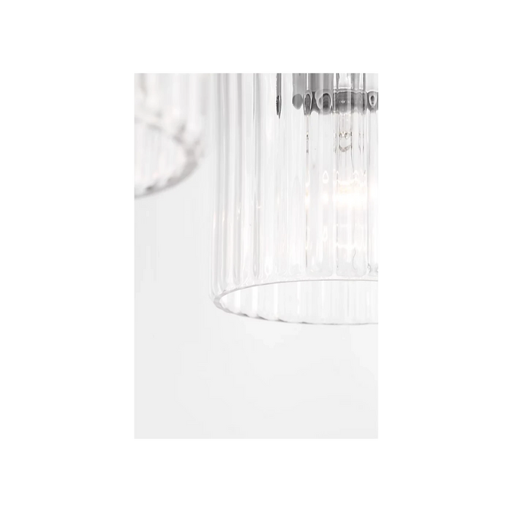 Maison Olive applique murale double en verre strié transparent et métal brossé argenté, éclairage d'ambiance moderne.