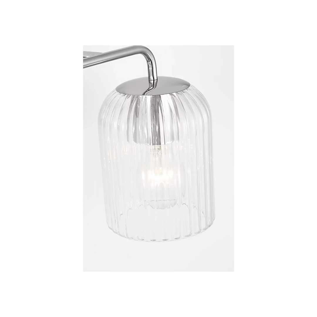 Maison Olive Applique murale double en verre strié et métal brossé argenté, éclairage d'ambiance moderne.