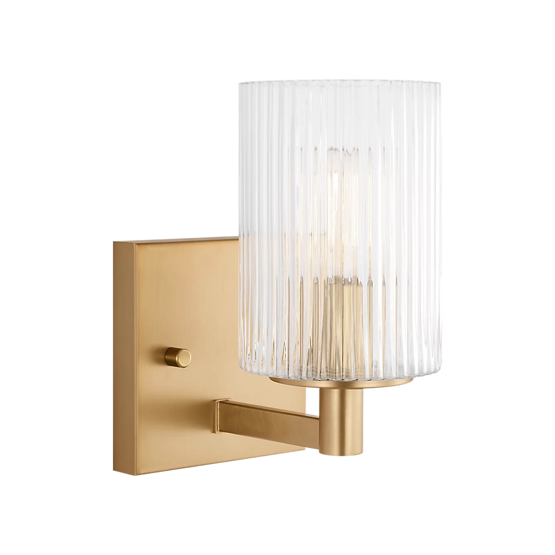 Maison Olive applique murale en verre strié transparent et métal brossé doré, design cylindrique moderne.