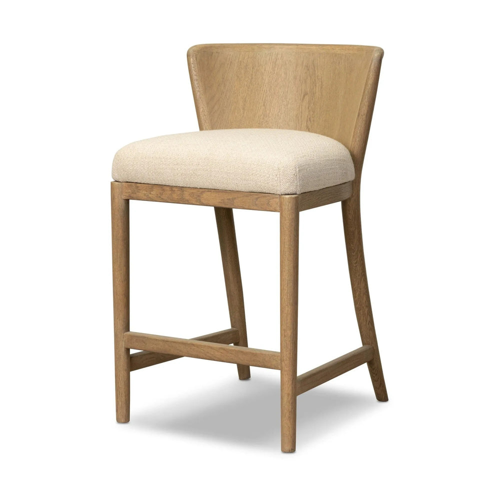 Maison Olive Chaise de bar en bois clair avec assise rembourrée en tissu crème, design épuré et naturel.
