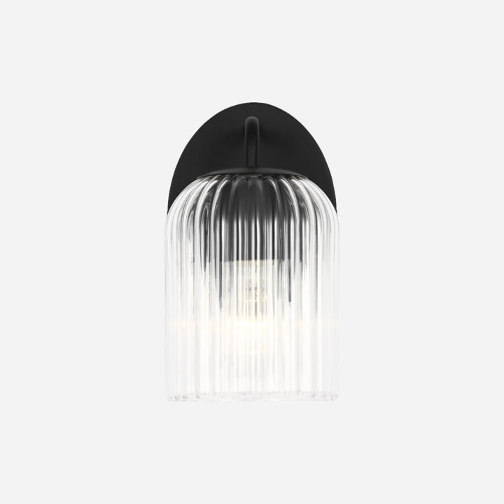Applique murale Maison Olive EISELE avec base noire et abat-jour en verre cannelé transparent au design minimaliste