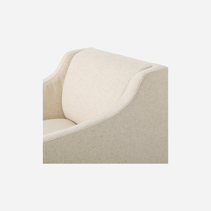 Fauteuil pivotant Maison Olive en tissu texturé beige, design moderne et confortable pour le salon.