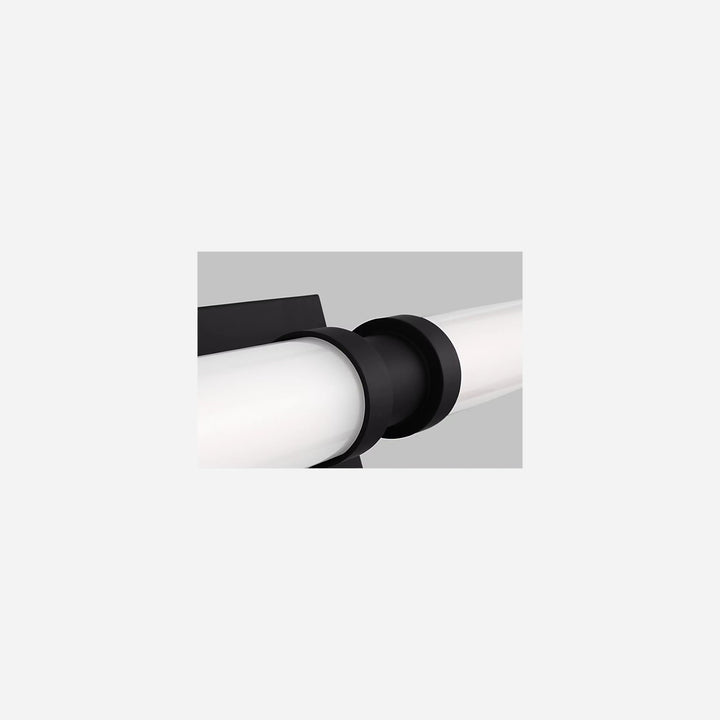 Applique murale Maison Olive Kiel avec diffuseur cylindrique en verre givré et support noir minimaliste