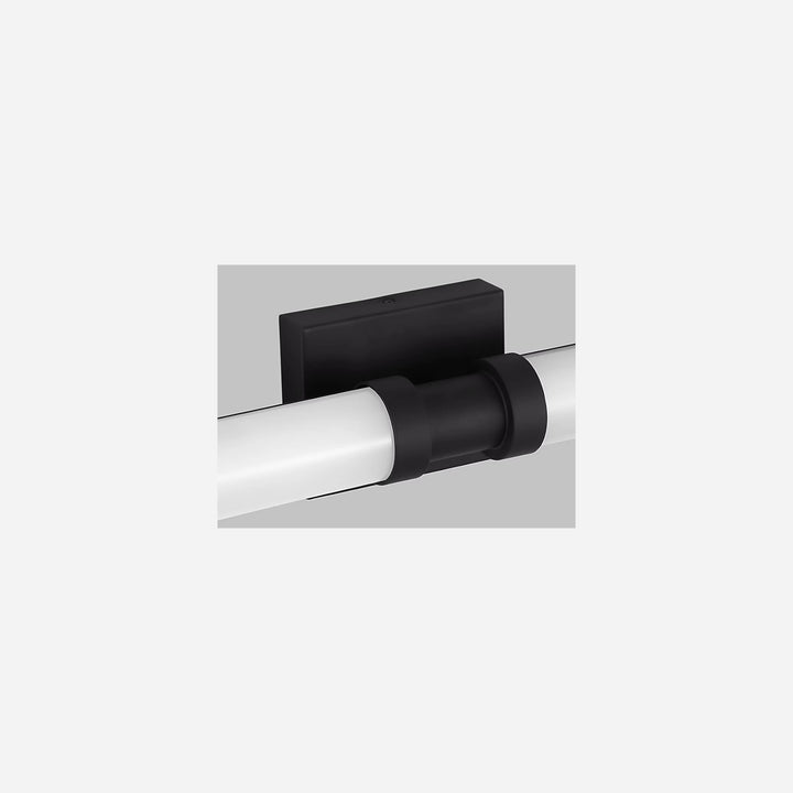 Applique murale Maison Olive Kiel avec diffuseur cylindrique en verre givré et support noir mat minimaliste
