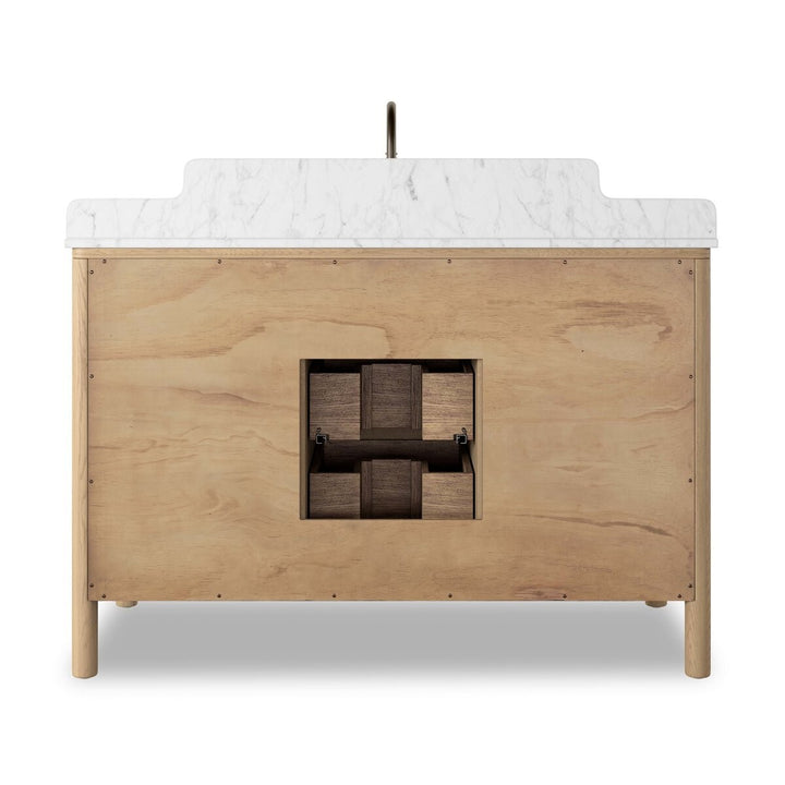 Meuble de salle de bain Maison Olive en bois clair avec plateau marbre blanc, 3 tiroirs et 2 portes. Style moderne.
