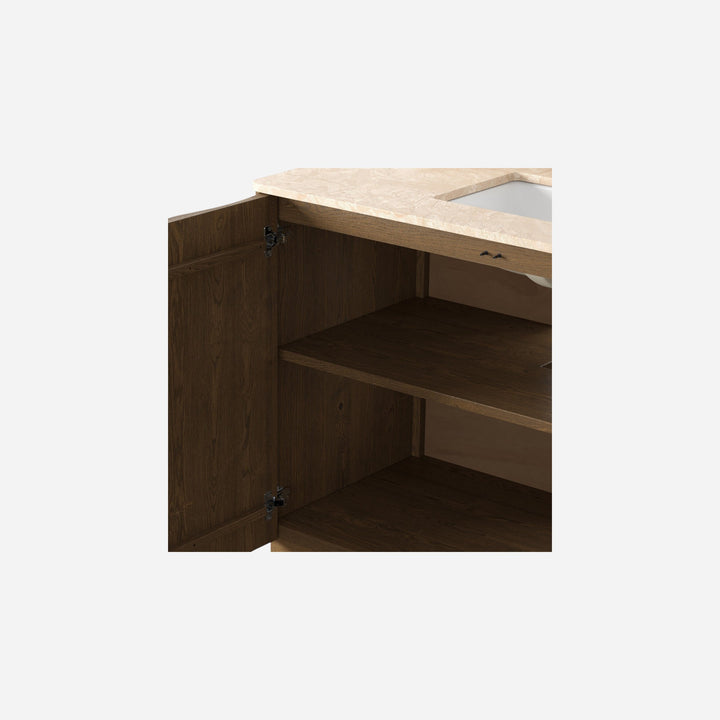 Maison Olive meuble de salle de bain suspendu en bois de chêne avec plateau en marbre crème et vasque blanche. Rangement ouvert.