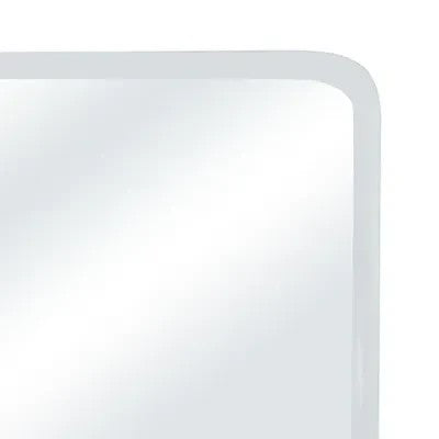 Gros plan sur le coin arrondi du miroir mural DANUSKE de Maison Olive avec cadre minimaliste