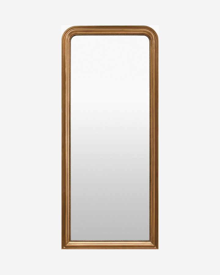 Miroir plein pied Maison Olive avec cadre en bois finition or antique, détails moulurés et coins supérieurs arrondis.