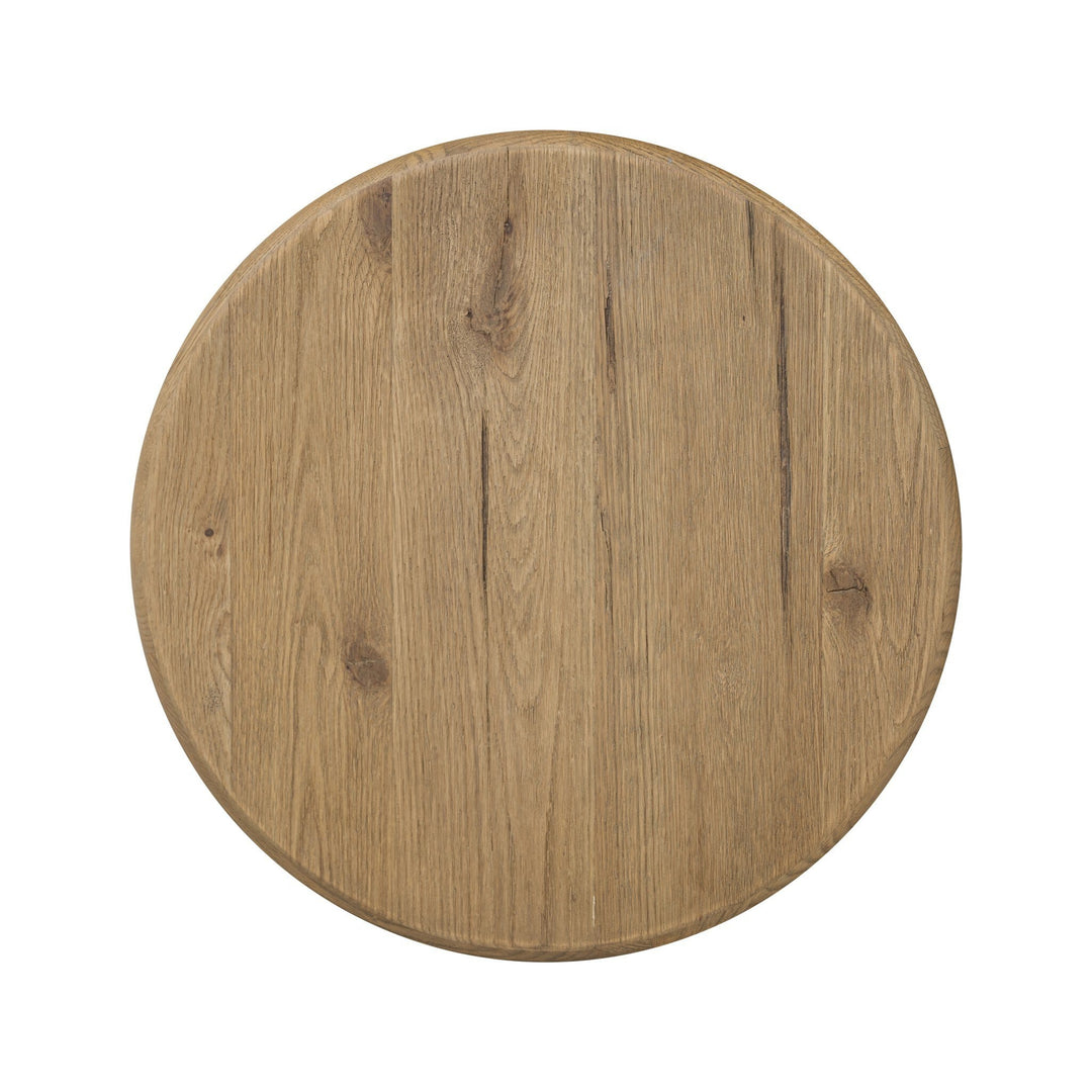 Maison Olive PADEN table d'appoint ronde en chêne patiné avec pieds en forme de croissant, style organique.