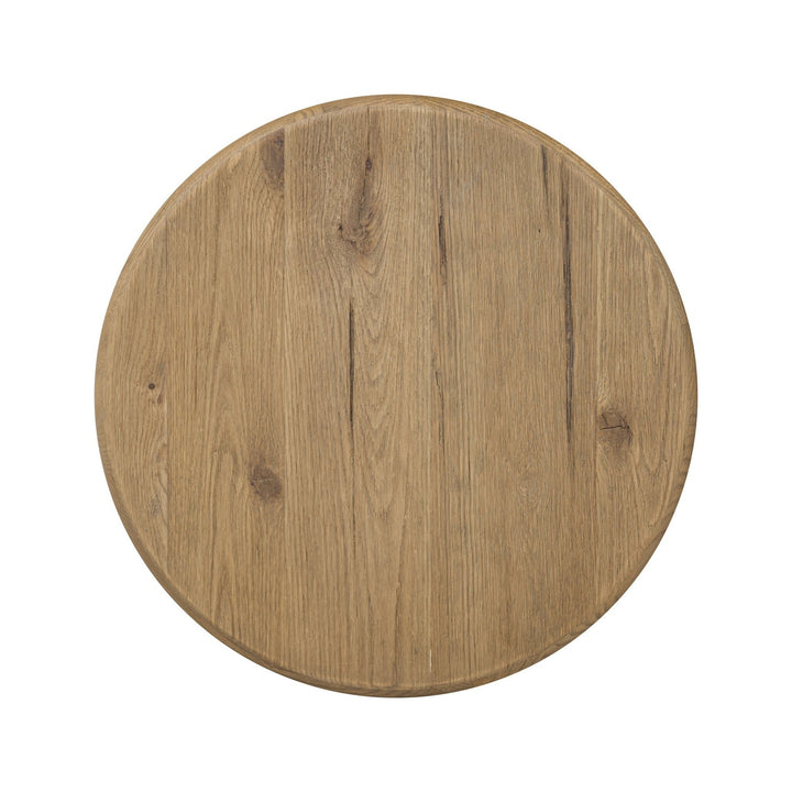 Maison Olive PADEN table d'appoint ronde en chêne patiné avec pieds en forme de croissant, style organique.