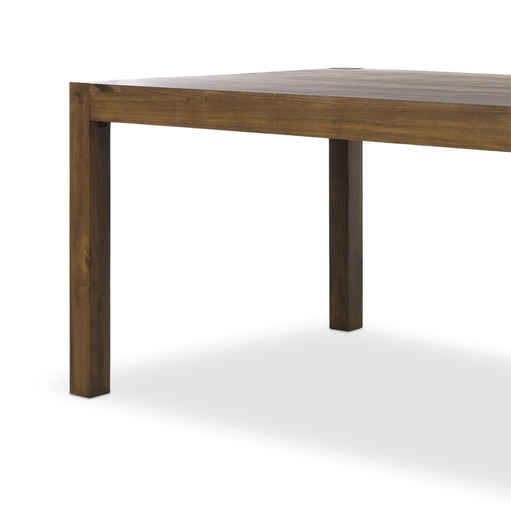 Maison Olive table basse contemporaine en bois massif brun foncé avec pieds carrés robustes.