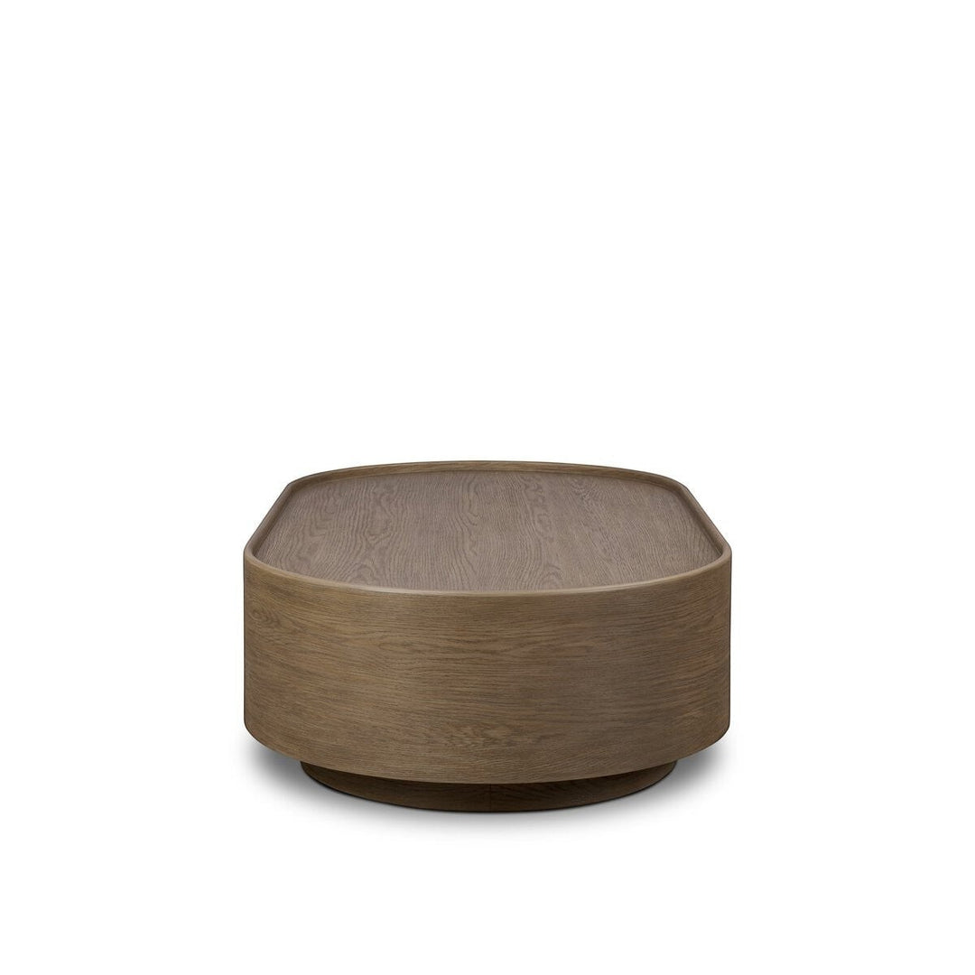 Maison Olive table basse ronde en bois de chêne naturel avec finition subtile et veinures riches.