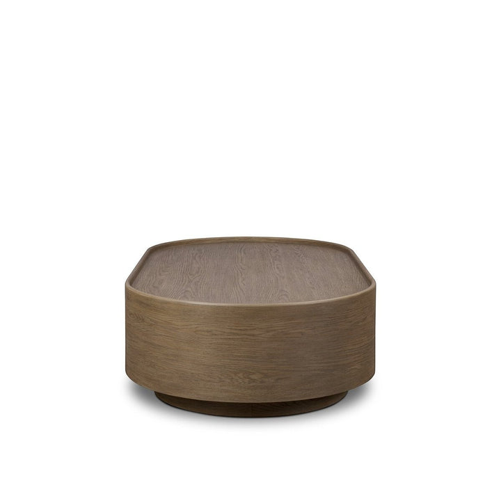 Maison Olive table basse ronde en bois de chêne naturel avec finition subtile et veinures riches.
