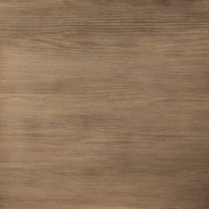 Maison Olive Table basse ronde en bois de chêne naturel avec finition subtile et veinures riches.