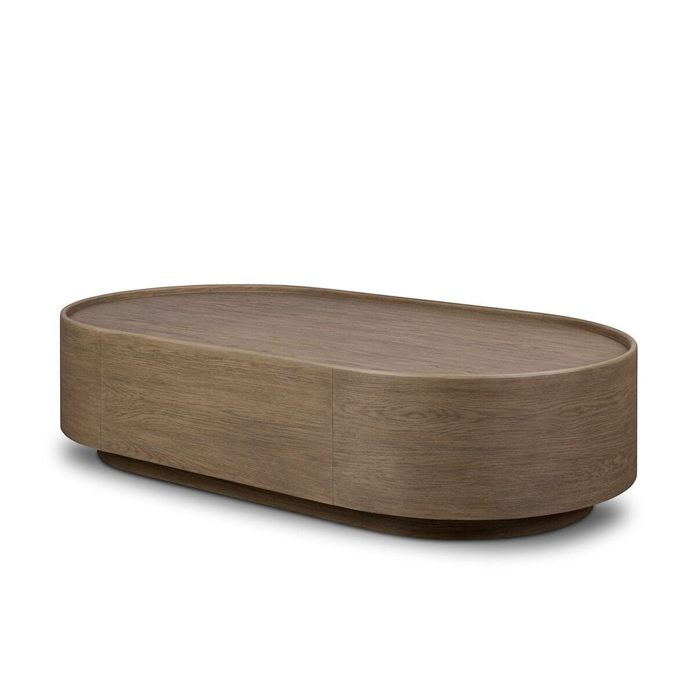 Maison Olive table basse ovale en bois de chêne naturel avec finition subtile et veinures riches.