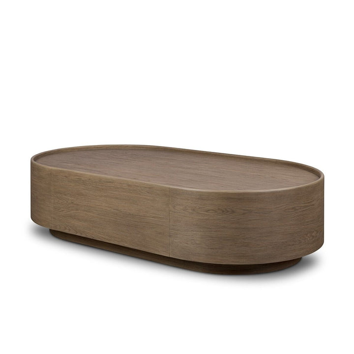 Maison Olive table basse ovale en bois de chêne naturel avec finition subtile et veinures riches.