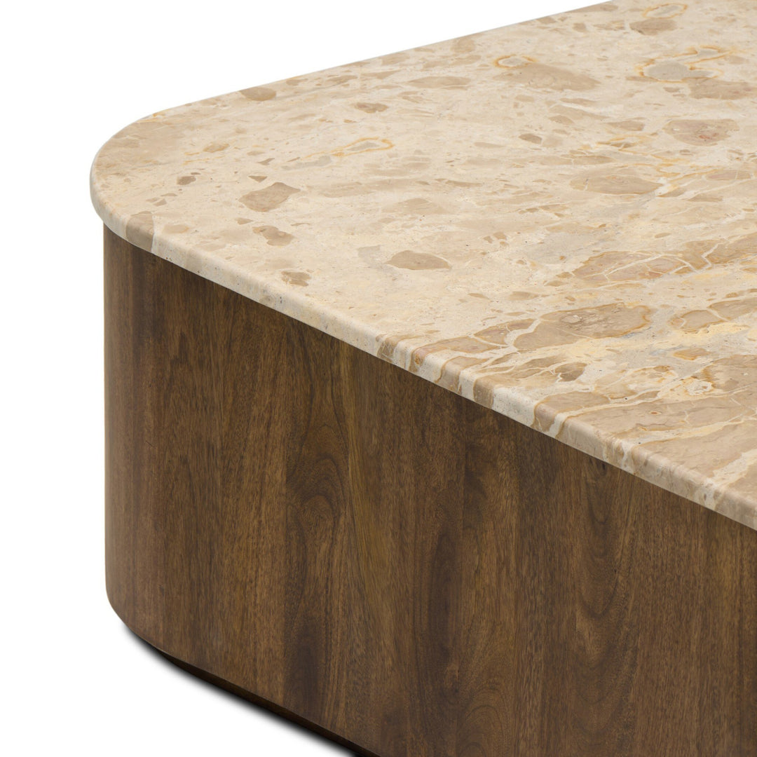 Table basse Maison Olive en marbre beige veiné et bois foncé, design arrondi, moderne et élégant.