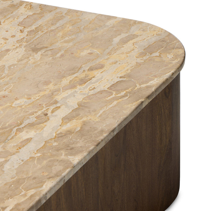 Table basse ronde Maison Olive en marbre beige veiné et bois foncé, design moderne et élégant.