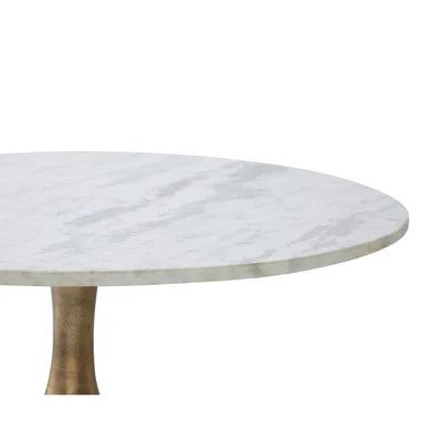 Table basse ronde Maison Olive avec plateau en marbre blanc et pied central en métal finition bronze vieilli