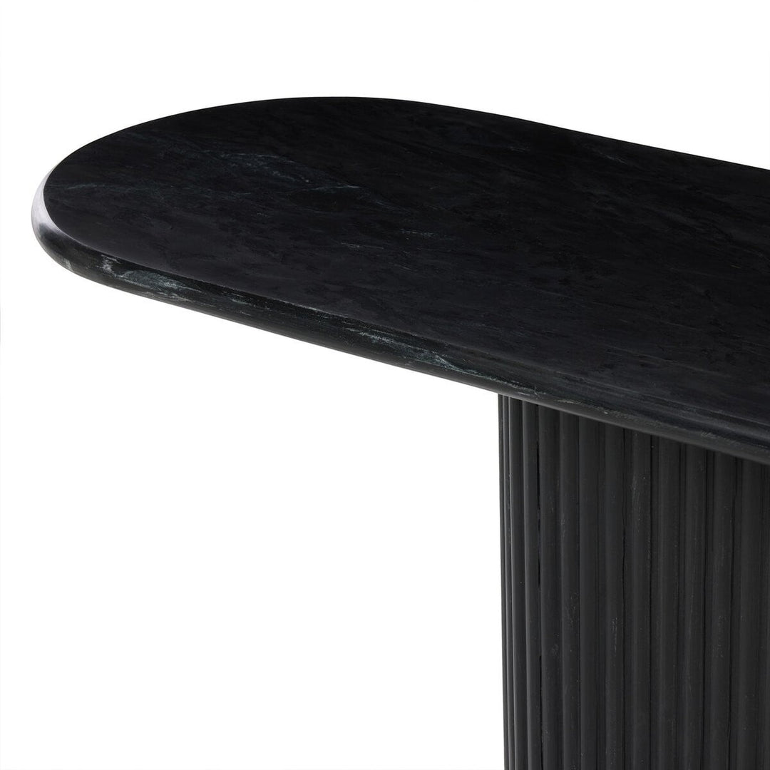 Maison Olive Table basse ovale en marbre noir veiné avec pied cannelé noir