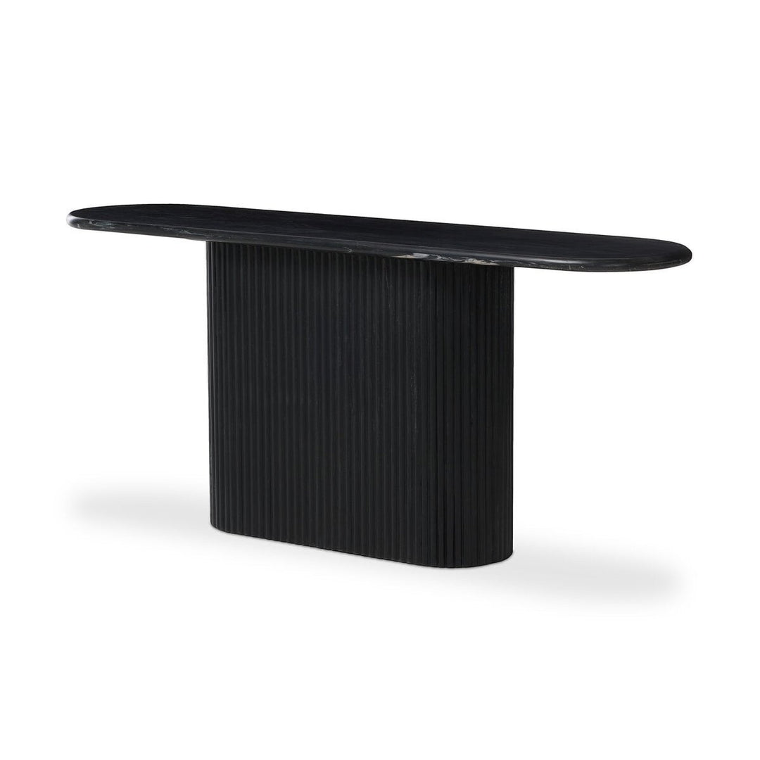 Maison Olive Table basse ovale en marbre noir veiné avec pied cylindrique cannelé noir.