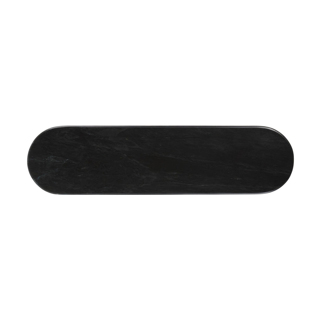 Maison Olive Table basse ovale en marbre noir veiné avec pied cannelé, design sculptural et moderne.
