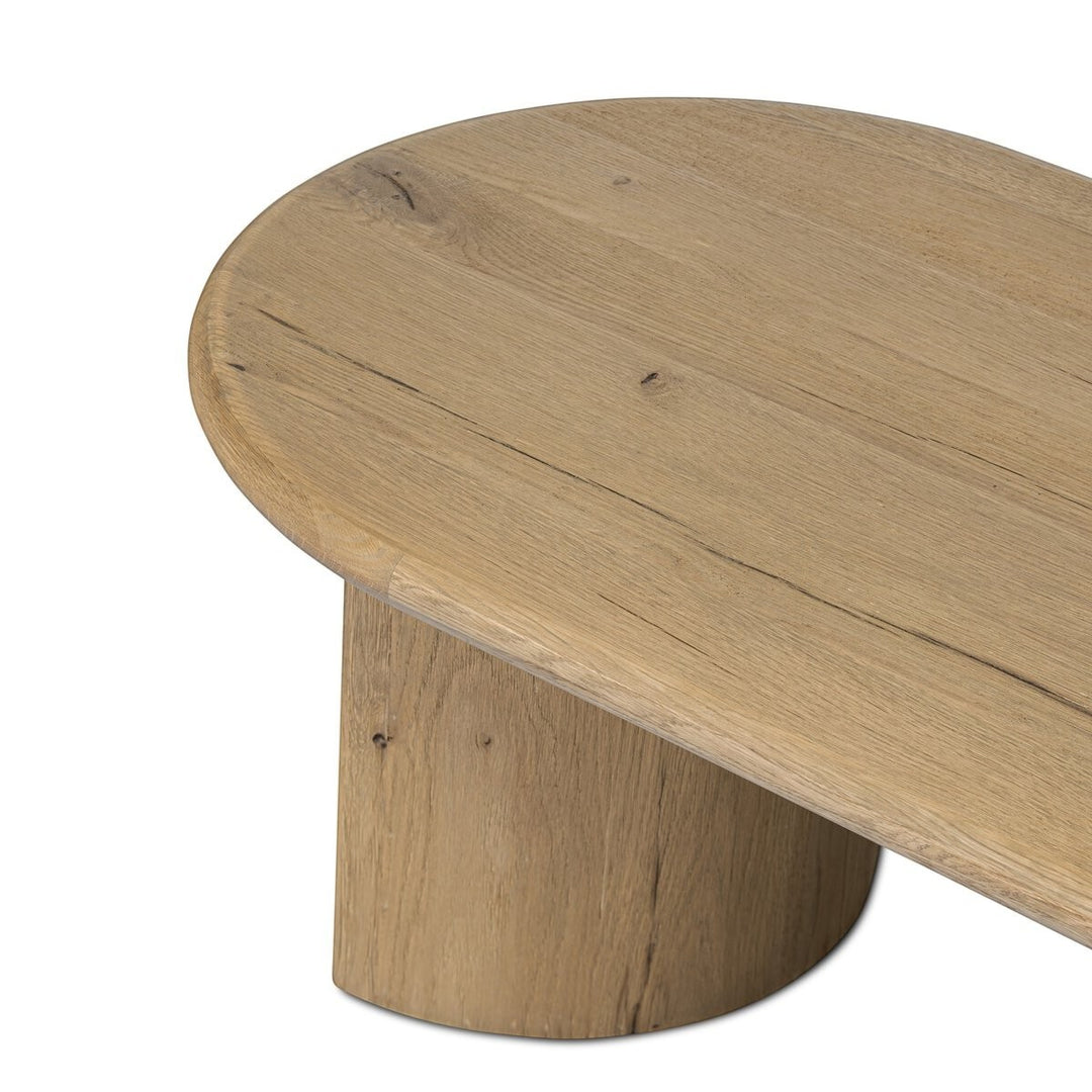Maison Olive Table basse PADEN en chêne naturel clair, plateau rond et pieds organiques.