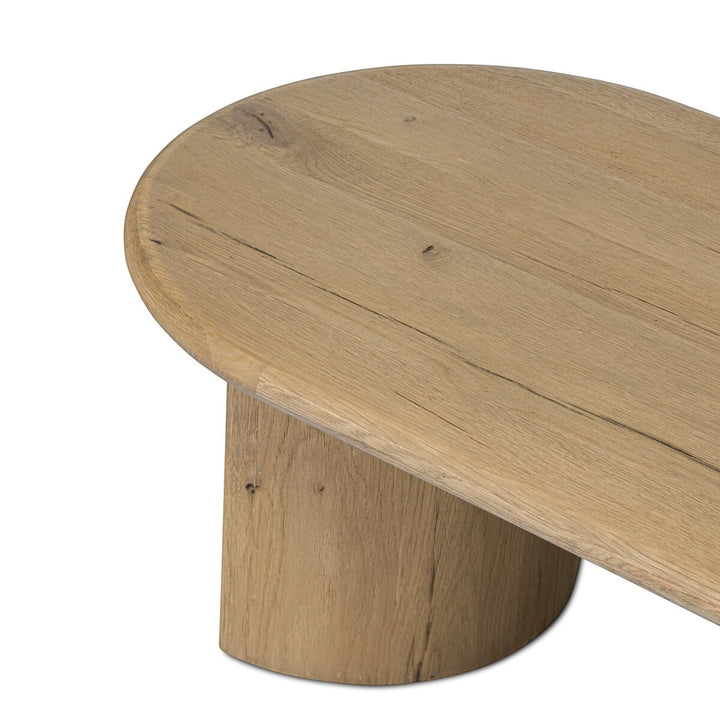 Maison Olive Table basse PADEN en chêne naturel clair, plateau rond et pieds organiques.