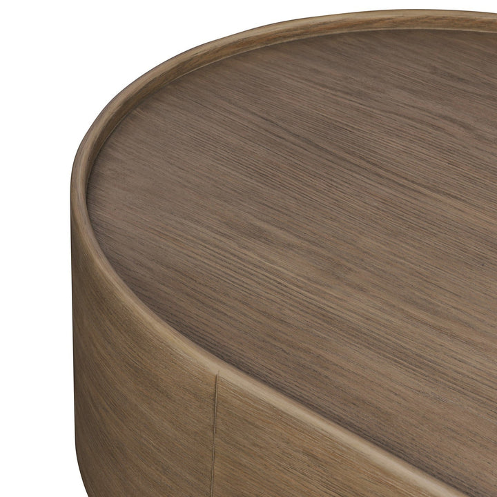 Maison Olive table basse ronde en bois naturel avec finition chêne, design organique et épuré.