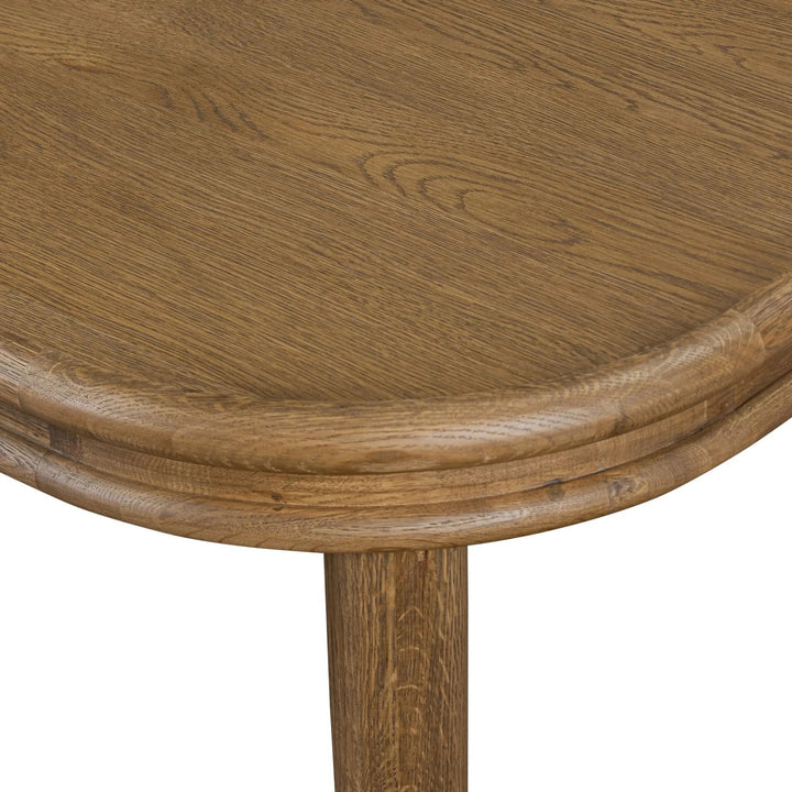 Maison Olive table en bois de chêne massif avec plateau arrondi et finition naturelle, piètement solide.