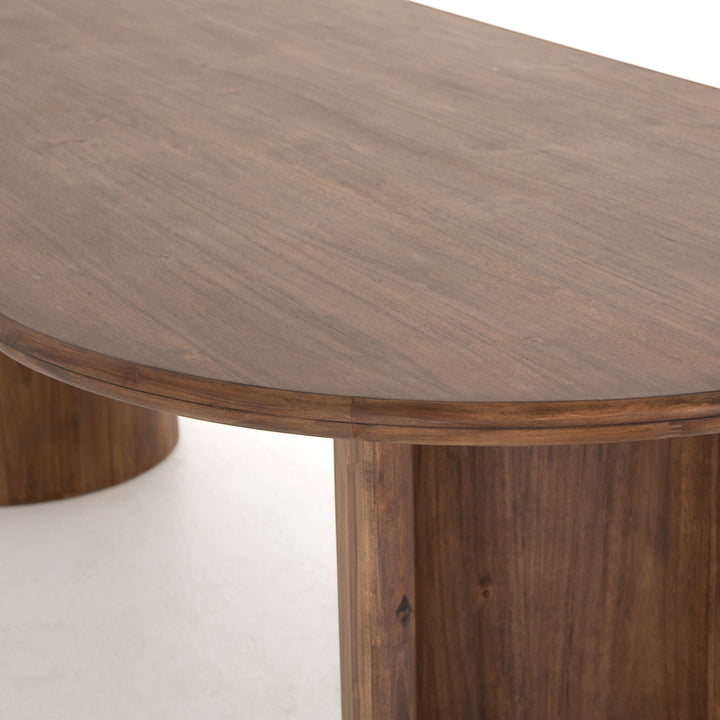 Table à manger ovale en bois d'acacia noir vieilli, design sculptural, piétement cylindrique, Maison Olive