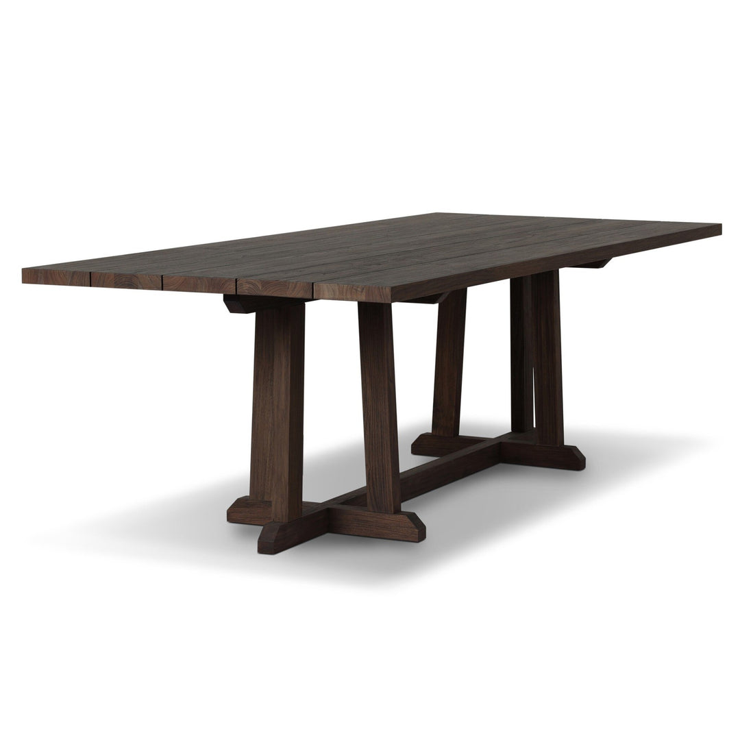 Maison Olive table à manger en bois de teck foncé, plateau à lattes, pieds croisés en H, style rustique moderne.