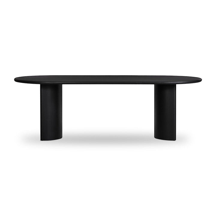 Table à manger ovale noire en bois massif Maison Olive avec piétement cylindrique moderne.
