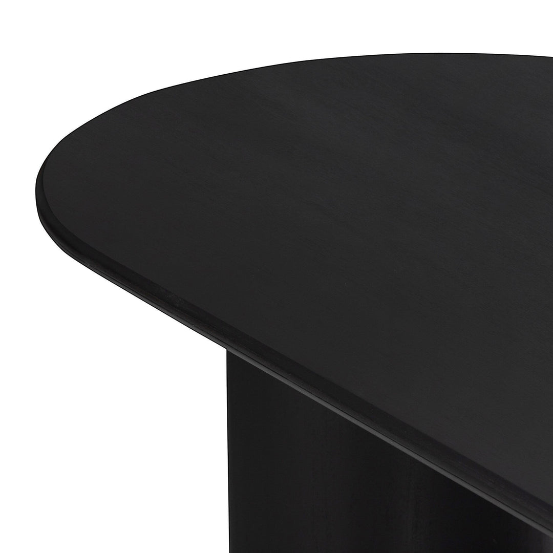 Table à manger ovale noire en bois massif Maison Olive avec piétement cylindrique