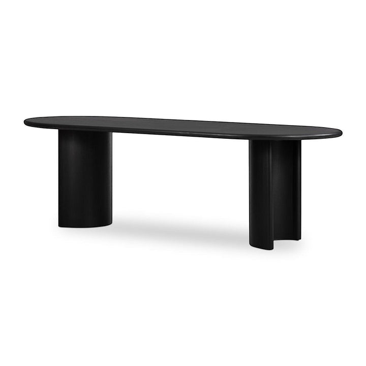 Maison Olive table à manger ovale en bois noir avec piétement cylindrique sculpté, design moderne.
