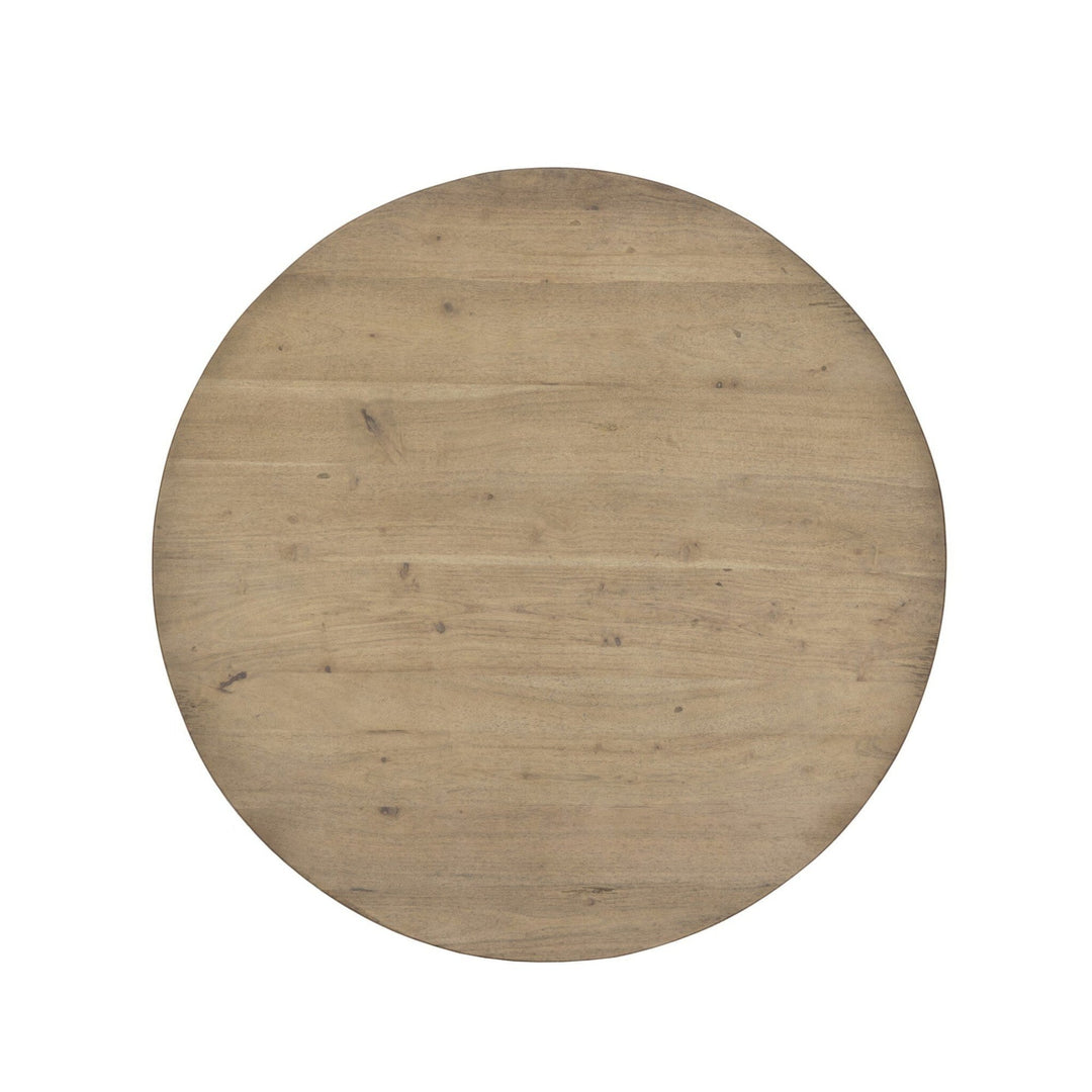 Maison Olive Table ronde en bois naturel avec plateau circulaire et grain visible, finition légèrement vieillie.
