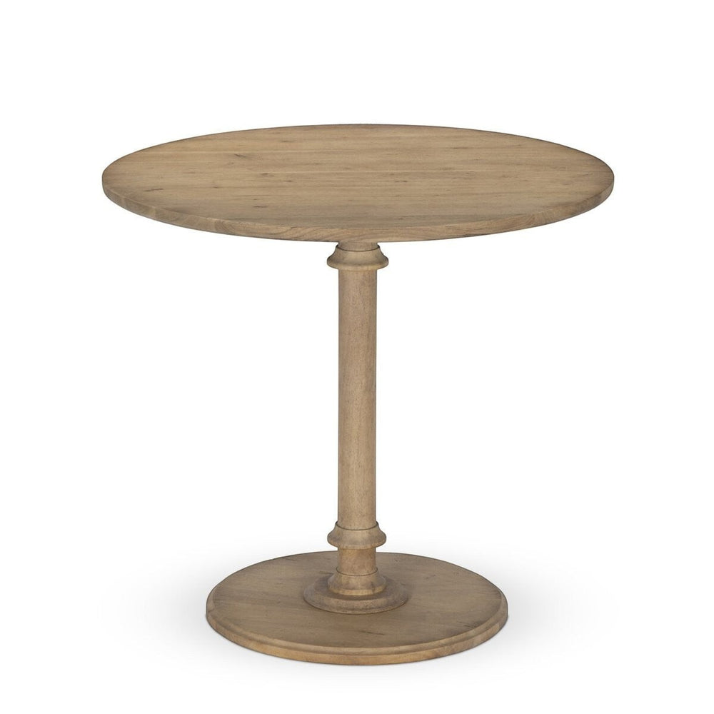 Maison Olive Table ronde en bois naturel avec pied central sculpté et base circulaire. Style rustique et élégant.