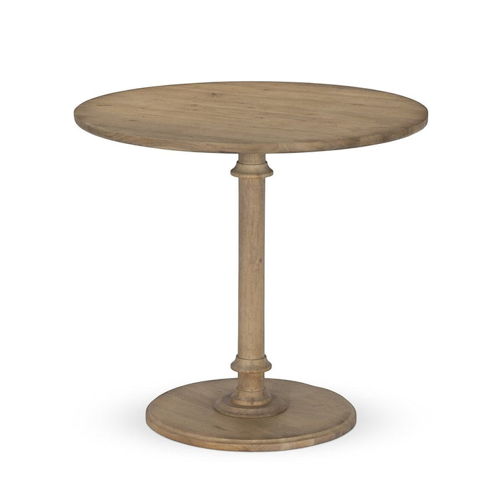 Maison Olive Table ronde en bois naturel avec pied central sculpté, finition vieillie, style rustique et élégant.