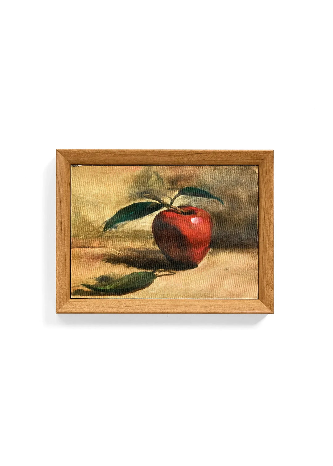 Tableau Maison Olive peinture à l'huile représentant une pomme rouge avec feuilles dans un cadre en bois clair