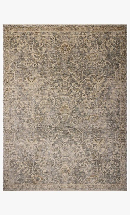 Tapis Maison Olive Junie bleu et naturel au motif antique tissé en polyester, style moderne et sophistiqué.