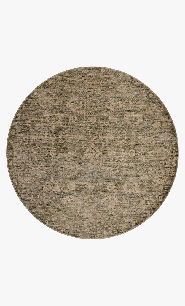 Tapis rond Maison Olive Junie Lagoon et naturel au motif antique vieilli, tissé en polyester doux et durable.
