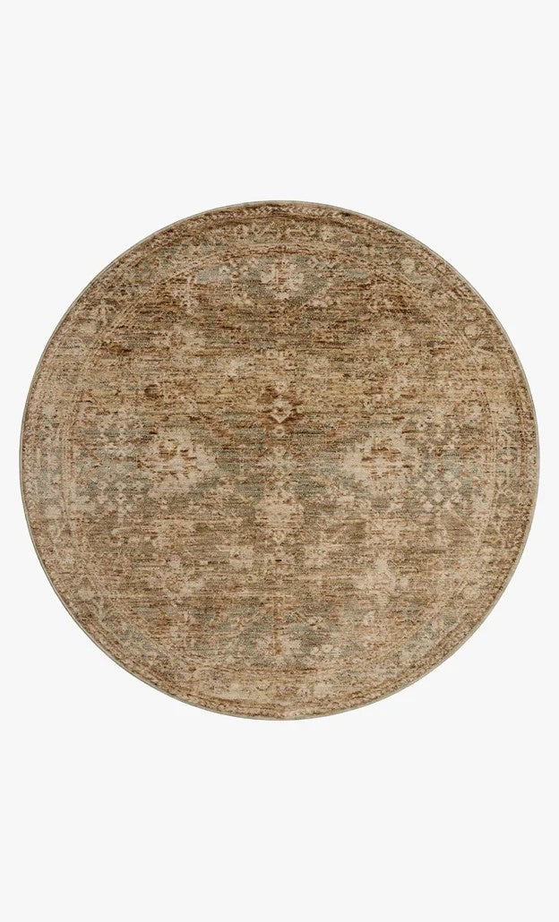 Tapis rond Maison Olive Junie aux motifs antiques dans des tons épicés et multicolores, en polyester doux.