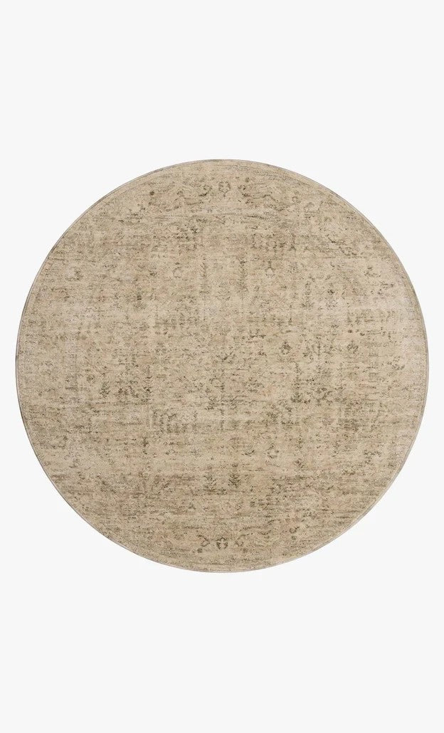 Tapis rond Maison Olive Junie en polyester couleur oatmeal et smoke avec motifs antiques subtils