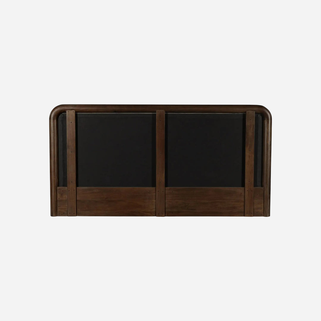 Vue arrière de la tête de lit Maison Olive en bois massif sombre avec structure incurvée et finitions artisanales