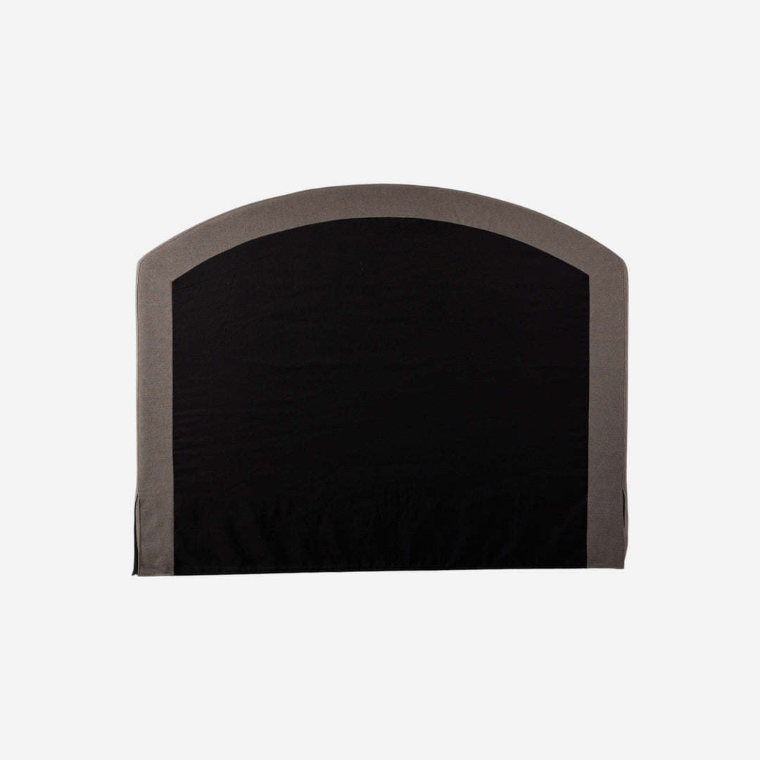 Maison Olive tête de lit capitonnée arquée en tissu texturé gris et crème, jupe de lit intégrée.